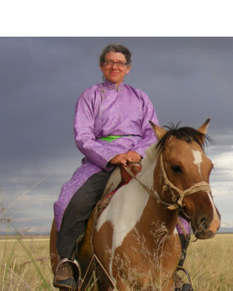 Maria Fernández-Giménez on horse back in Mongolia.