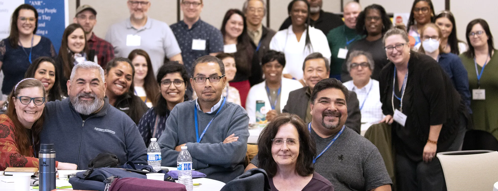 Group of people at the WIB summit smiling into the camera