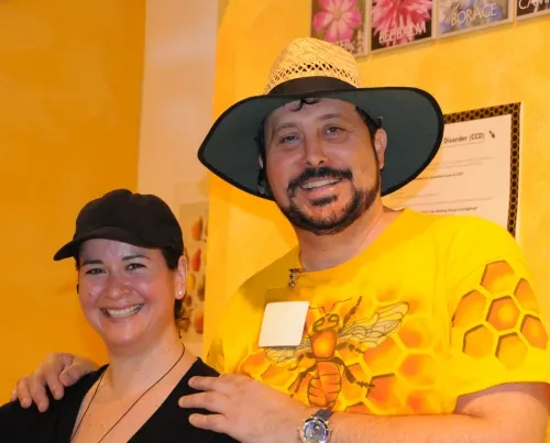 Karen Flores and Dennis Price: The bees have their attention and their respect. (Photo by Kathy Keatley Garvey)