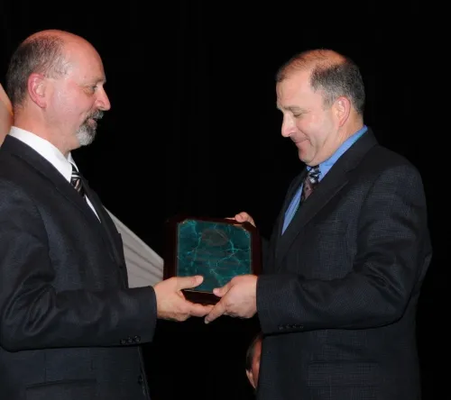 FELLOW AWARD--ESA President Michael Gray (left) presents the highly acclaimed Fellow award to UC Davis entomologist Michael Parrella. (Photo by Kathy Keatley Garvey)