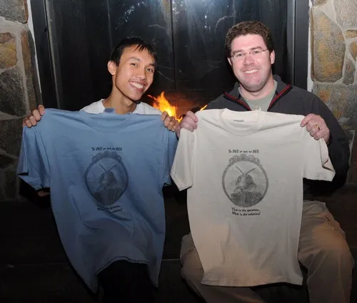 TO BEE OR NOT TO BEE--Yao Hua Law (left) and Randy Veirs hold up the "To Bee or Not to Bee" t-shirt. It is intended to do double duty: to raise funds for the UC Davis Entomology Graduate Students' Association and to raise awareness for the plight of honey bees. (Photo by Kathy Keatley Garvey)