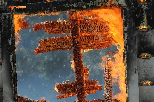 GLOWING EMBERS, soon reduced to rubble. The Baxter House site will be an access road to the Haagen-Dazs Honey Bee Haven. (Photo by Kathy Keatley Garvey)