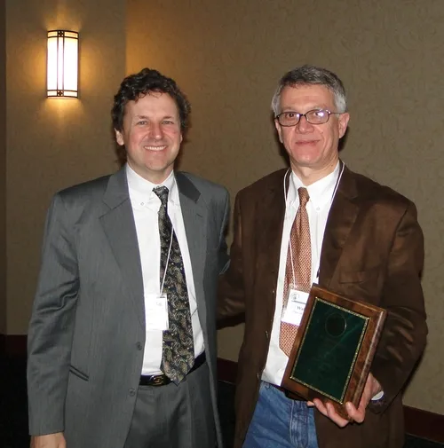 CHEMICAL ECOLOGIST Walter Leal (right) is the 2010 recipient of the prestigious C. W. Woodworth Award, presented by Woodworth's great-grandson Brian Holden (left) at the 94th annual meeting of the Pacific Branch of the Entomological Society of America. (Courtesy Photo)