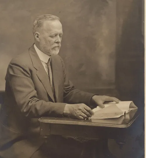 NOTED AMERICAN ENTOMOLOGIST Charles W. Woodworth, shown here reading at his desk, is memorialized with the C. W. Woodworth Award, presented at the annual meeting of the Pacific Branch of the Entomological Society of America. (Photo Courtesy of Brian Holden)