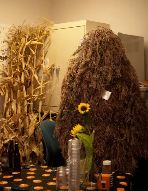 FORENSIC ENTOMOLOGIST Bob Kimsey is in there somewhere. He's dressed in a ghillie suit, camouflaged clothing typically worn during a turkey hunt or military maneuvers. (Photo by Louie Yang)