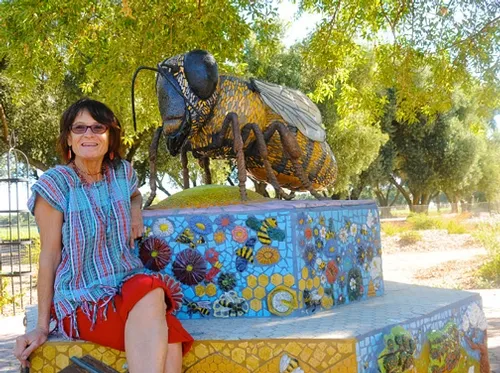 ROCK ARTIST Donna Billick, with her sculpture, "Miss Bee Haven," at the Haagen-Dazs Honey Bee Haven, Harry H. Laidlaw Jr. Honey Bee Research Facility at UC Davis. Billick will be showing some of her work at the Pence Art Gallery, Davis, Nov. 23-Dec. 23. (Photo by Kathy Keatley Garvey)