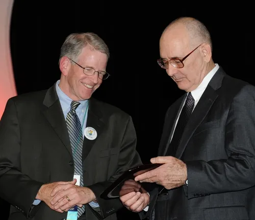 THOMAS MILLER (right) of the University of California, Riverside receives congratulations from Dave Hogg, president of ESA. Miller was one of 10 Fellows honored at the ESA ceremony in San Diego. (Photo by Kathy Keatley Garvey)
