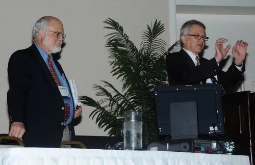 CHEMICAL ECOLOGISTS John Hildebrand (left) of the University of Arizona and Walter Leal of the University of California, Davis, organized and moderated a lively discussion at their seminar at the Entomological Society of America's 58th annual meeting, held recently in San Diego. (Photo by Kathy Keatley Garvey)