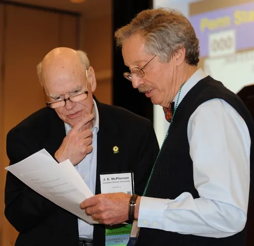 EMCEE Tom Turpin (right) of Purdue University confers with judge J. E. McPherson of Southern Illinois University. (Photo by Kathy Keatley Garvey)
