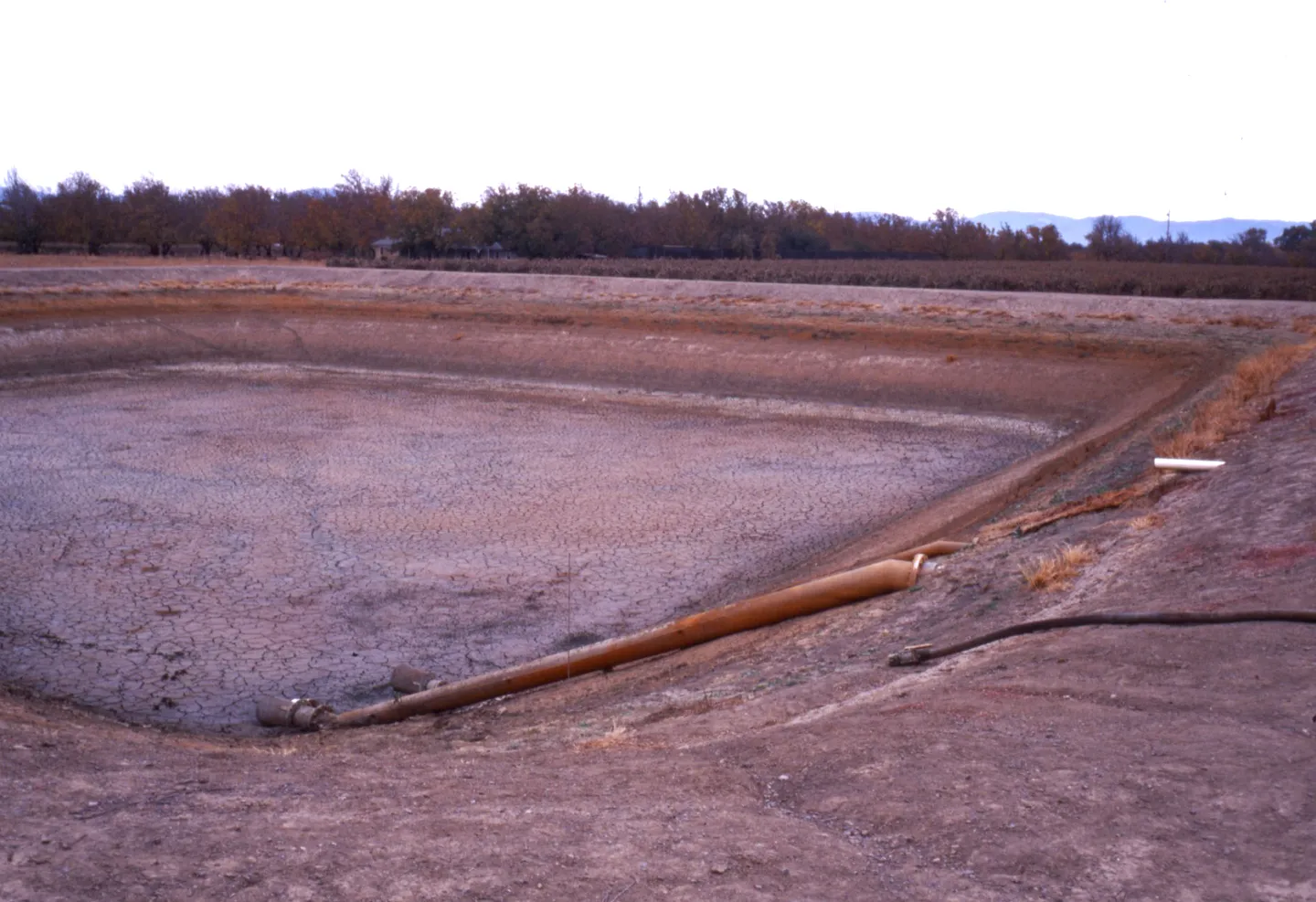 Empty storage reservoir used to settle out precipitated iron from a high iron groundwater source. Photo: L. Schwankl