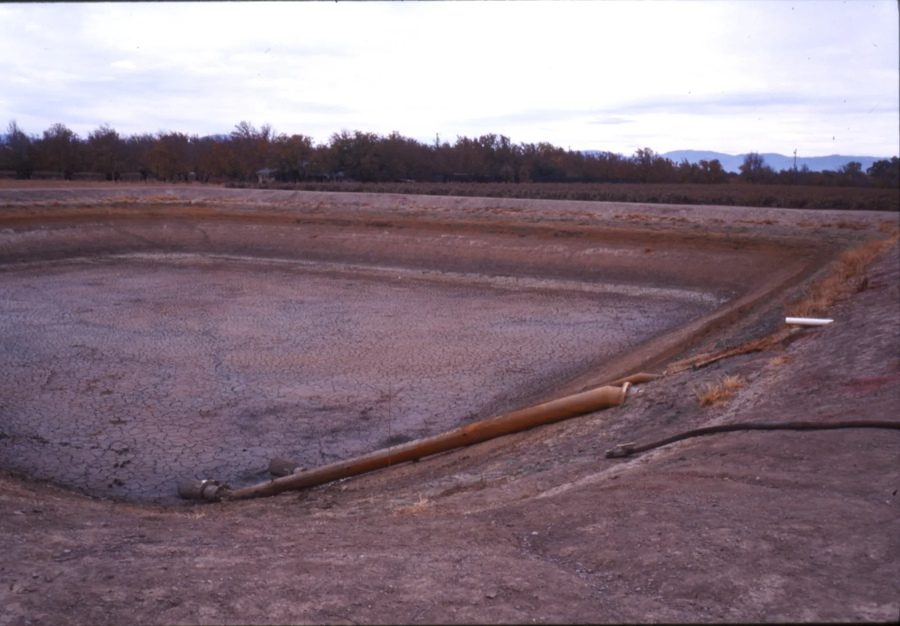 Drained reservoir used for settling iron from groundwater source. Photo: L. Schwankl