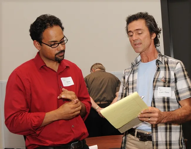 UC Davis assistant professor Brian Johnson (left) answers a question from beekeeper Clay Ford of Vacaville. (Photo by Kathy Keatley Garvey)