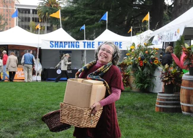 Kathy Kellison, executive director of Partners for Sustainable Pollination, headquartered in Santa Rosa, delivers information to the 2011 beekeepers' booth. (Photo by Kathy Keatley Garvey)