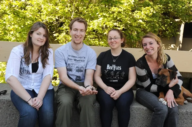 The winning Davis Linnaean Team is comprised of (from left) Kelly Hamby, Matan Shelomi, Kelly Liebman and Jenny Carlson. With them is mascot, Max. (Photo by Kathy Keatley Garvey)