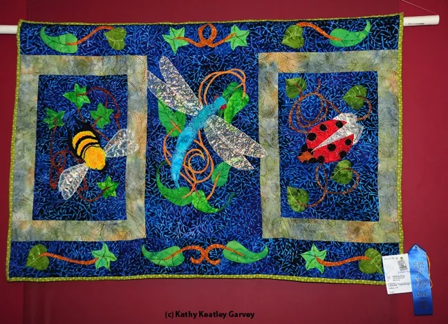 Close-up of blue-ribbon quilt by LaQuita Tummings of Vallejo. It features a bee, dragonfly and ladybug. (Photo by Kathy Keatley Garvey