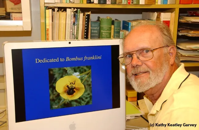 Robbin Thorp with his computer screen showing a photo he took of Franklin's bumble bee, one of the world's 100 most endangered species. (Photo by Kathy Keatley Garvey)