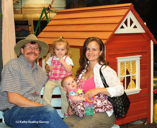 The Fishbacks at the 2013 Dixon May Fair where they had just dropped off a bee observation hive: Brian, daughter Emily, now 3; daughter Jane, now 18 months, and wife Darla. (Photo by Kathy Keatley Garvey)