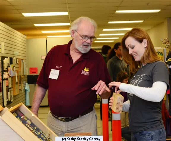 Native pollinator specialist Robbin Thorp, emeritus professor of entomology at UC Davis, shows Danielle Wishon of the California Department of Food and Agriculture a bee condo. (Photo by Kathy Keatley Garvey)