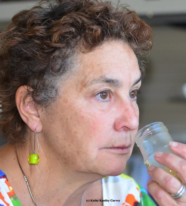 Amina Harris sniffs the aroma. (Photo by Kathy Keatley Garvey)