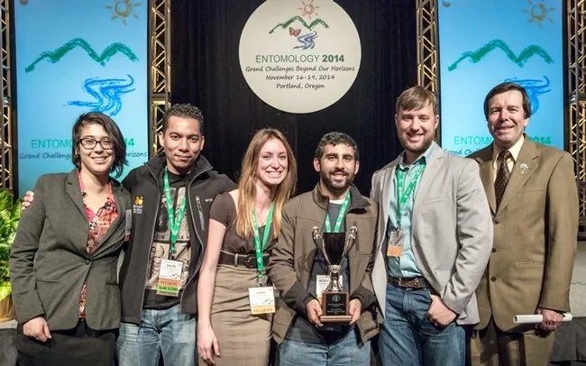 The UC Davis team included (from left) Margaret “Rei” Scampavia, Ralph Washington Jr., Jenny Carlson, captain Mohammad-Amir Aghaee and Danny Klittich. At far right is ESA president Frank Zalom of UC Davis who presented the team with its award. (Photo by Trav Williams of Broken Banjo Photography