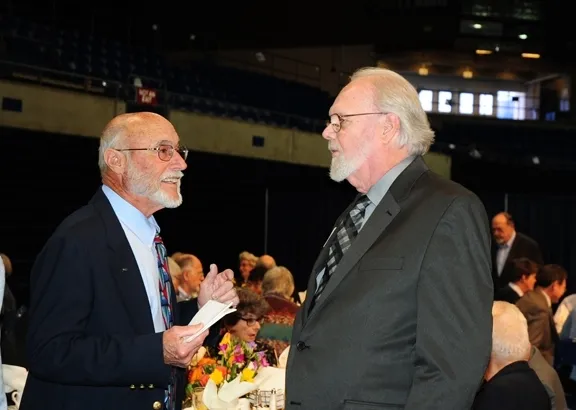 Emcee Bill Rains (left) congratulations Robbin Thorp. (Photo by Kathy Keatley Garvey)