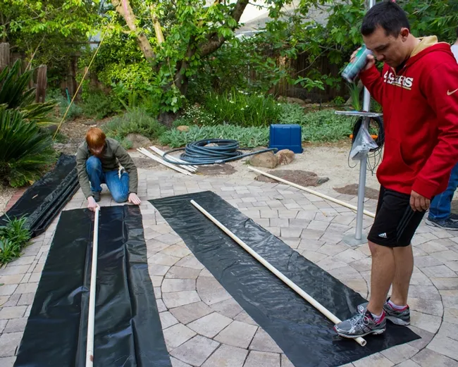 Working on the float are (from left) member Ben Maples and president Marko Marrero (Photo by Alex Nguyen)