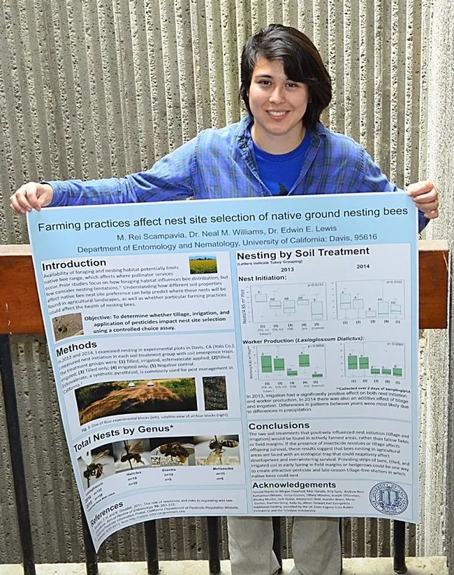 Rei Scampavia with her first-place research poster, “Farming Practices Affect Nest Site Selection of Native Ground Nesting Bees." (Photo by Kathy Keatley Garvey)