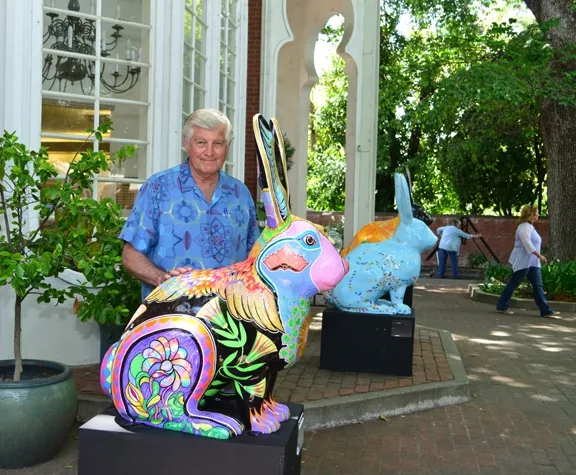 Artist Richard Rico, former editor and publisher of The Reporter, Vacaville, stands by his work, "Flyin' Jack." (Photo by Kathy Keatley Garvey)