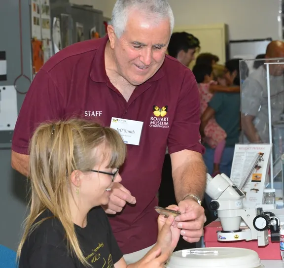 Entomologist Jeff Smith, a Bohart Museum associate, explains how to spread a moth's wings to Lauren Mitchell, a UC Davis student majoring in ecology, evolution and diversity. (Photo by Kathy Keatley Garvey)