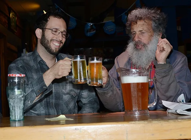 UC Davis student Jacob Montgomery (left) and Professor Art Shapiro toast the first flight of a cabbage white, found in the three-county area of Sacramento, Yolo and Solano. (Photo by Kathy Keatley Garvey)