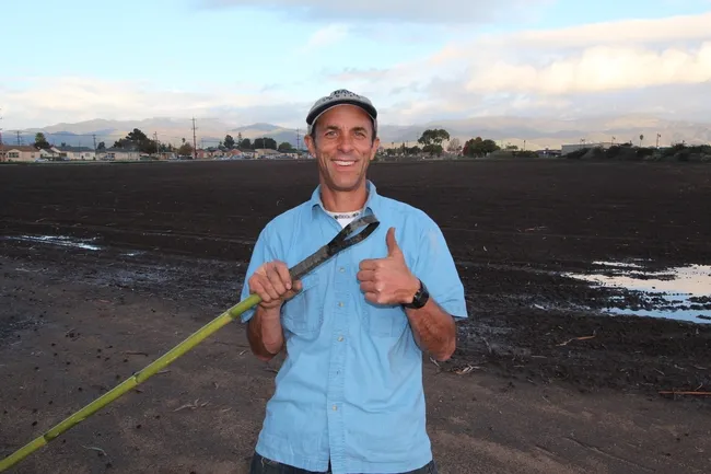 Dr. Eric Brennan with a Recycle Strap Hoe