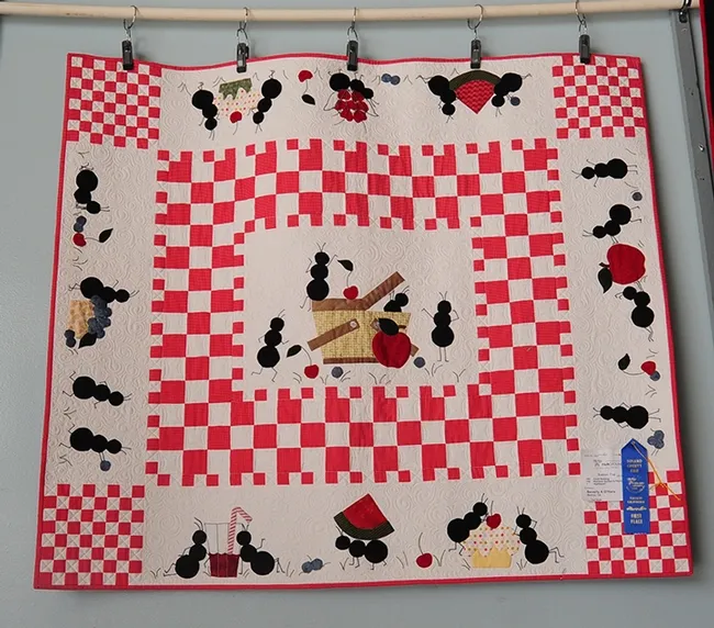 What's a picnic without ants? Beverly O'Hara of Benicia appliqued this quilt, titling it "Ant-titude." (Photo by Kathy Keatley Garvey)