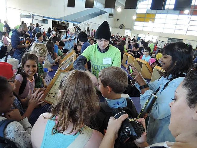Bohart associate Parras McGrath greets the third graders. (Photo by Kathy Keatley Garvey)