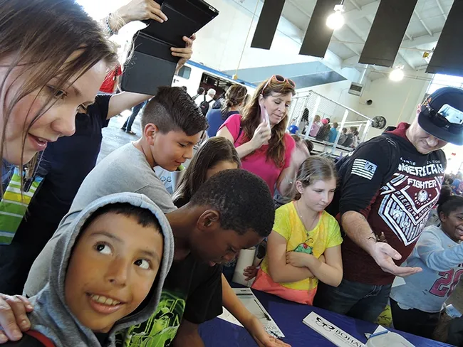 It was like a photo shoot at the Bohart Museum's booth. (Photo by Kathy Keatley Garvey)