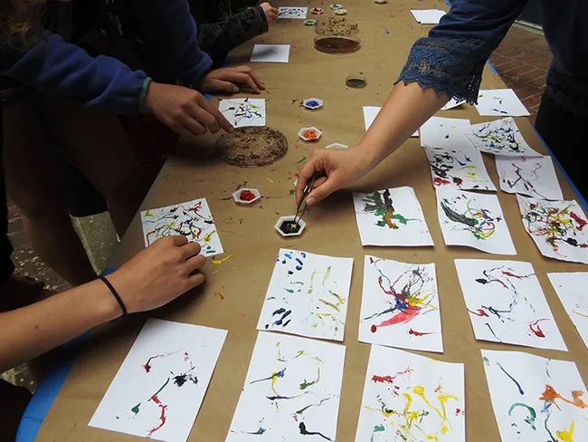 Artists creating Maggot Art at the 2017 UC Davis Picnic Day celebration at Briggs Hall. (Photo by Kathy Keatley Garvey)