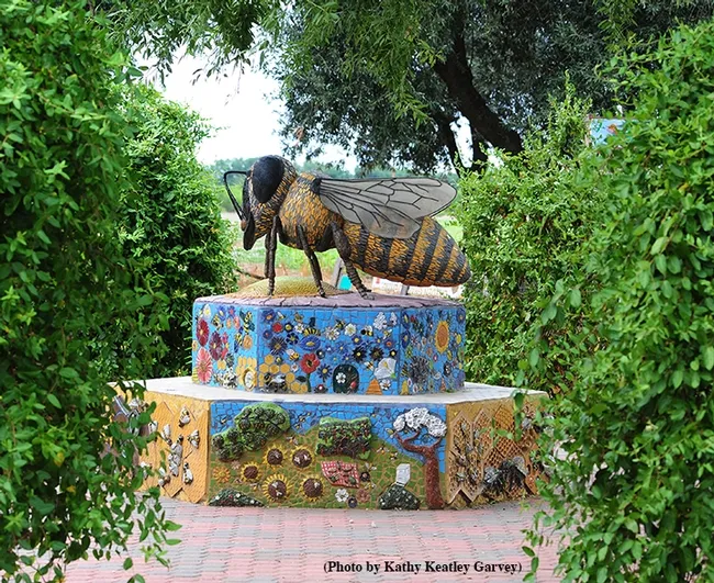 This is Miss Bee Haven, a ceramic-mosaic sculpture by self-described "rock artist" Donna Billick of Davis, co-founder and co-director of the UC Davis Art-Science Fusion. It anchors the Häagen-Dazs Honey Bee Haven. (Photo by Kathy Keatley Garvey)