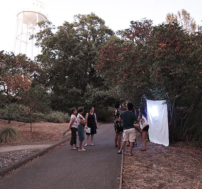 This was the scene at the blacklighting display Saturday night, July 22 at the Bohart Museum of Entomology. Greg Kareofelas (far right) had just set up the display. (Photo by Kathy Keatley Garvey)