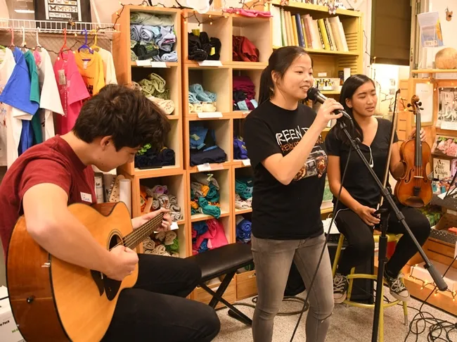 And the band played on! From left are James Heydon on guitar, vocalist Maia Lundy (UC Davis entomology graduate) and her sister, Jade Lundy, on violin. (Photo by Kathy Keatley Garvey)