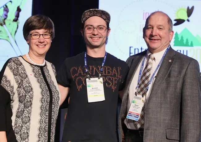 Brendon Boudinot (center) is the recipient of a first-place President's Prize for the second consecutive year in the Entomological Society of America's annual graduate student competition. With him are outgoing ESA president Susan Weller, director of the University of Nebraska State Museum; and incoming ESA president Michael Parrella, dean of the College of Agricultural and Life Sciences, University of Idaho, and former professor/chair of the UC Davis Department. (ESA Photo)