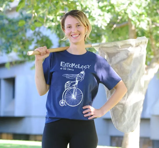 Stacey Rice, a former junior specialist in the lab of the late Extension entomologist Larry Godfrey, designed this t-shirt she is wearing. This is "Hymenoptera on Bicycle."(Photo by Kathy Keatley Garvey)