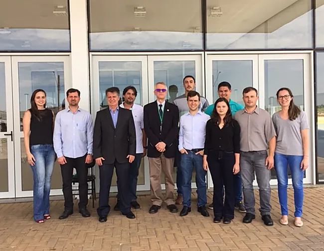 The Asian Citrus Psyllid Team: Scientists in the front row (from left) are Tatiana Mulinari, Rodrigo Magnani, Antonio Juliano Ayres, Walter Leal, Marcelo Miranda, Victoria Esperanca, Odimar Zanardi, and Rejane Luvizotto. The three scientists in back are Haroldo X. L. Volpe (white shirt) Renato de Freitas and Rômulo Carvalho.