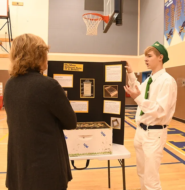 Vaca Valley 4-H'er and beekeeper Ian Weber answers questions from evaluator JoAnn Brown, Suisun Valley 4-H Club project leader and community club leader. (Photo by Kathy Keatley Garvey)