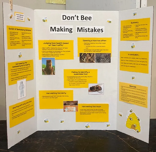 Beekeeper Francis Agbayani, 12, of the Vaca Valley 4-H Club, Vacavile, is displaying his 4-H project, "Don't Bee Making Mistakes," a blue-ribbon winner. (Photo by Kathy Keatley Garvey)