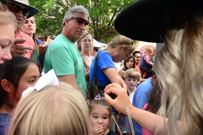 Expressions ranged from awestruck to delight to excitement as a drone was passed around. (Photo by Kathy Keatley Garvey)