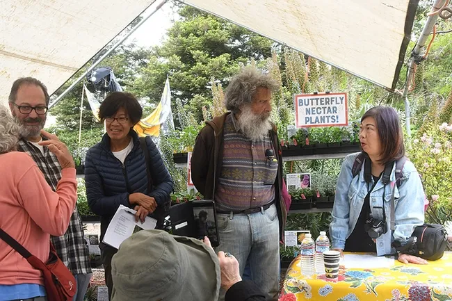 Following Art Shapiro's talk, attendees line up to speak to him. (Photo by Kathy Keatley Garvey)