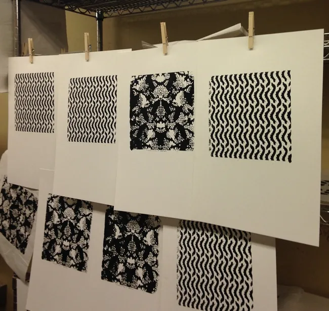 Silkscreen work hanging on a wire. It will be displayed June 6 at an art exhibit from 6 to 8 p.m. in the Environmental Horticulture courtyard.