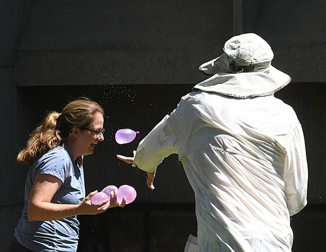 In this 2017 photo, Hammock lab administrator Cindy McReynolds, now a doctoral student in the Hammock lab, tries to avoid a balloon. (Photo by Kathy Keatley Garvey)