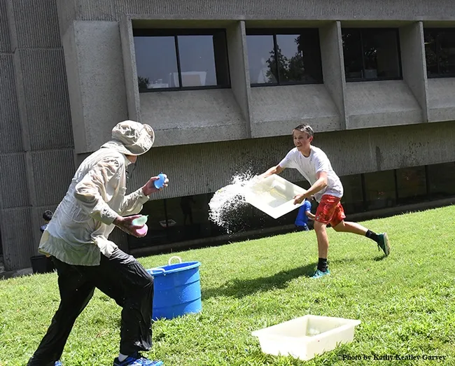 Scene One: UC Davis undergraduate student Andrew Kisin of the Aldrin Gomes lab, charges toward distinguished professor Bruce Hammock. (Photo by Kathy Keatley Garvey)