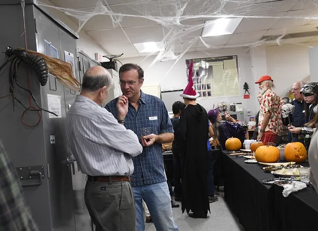 Jason Bond (right) the Evert and Marion Schlinger Endowed Chair in Insect Systematics in the UC Davis Department of Entomology and Nematology, chats with Bruce Hammock, distinguished professor of entomology. (Photo by Kathy Keatley Garvey)
