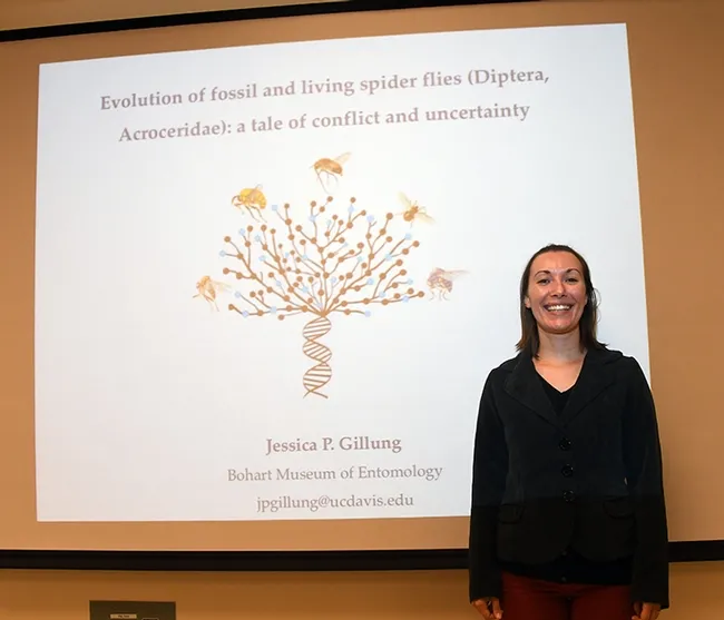 Entomologist Jessica Gillung stands by her exit seminar slide. (Photo by Kathy Keatley Garvey)